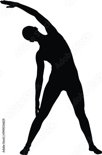 Silhouette of a person stretching sideways in a yoga pose