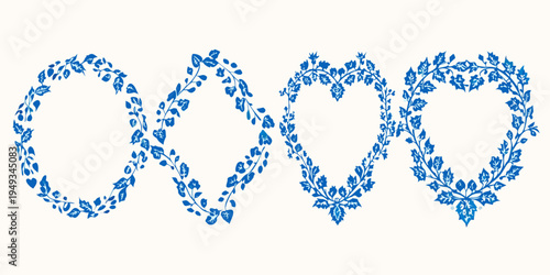 Two ornate heart shaped frames composed of delicate blue foliage