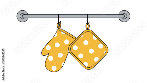 Yellow oven mitt and matching square pot holder with white polka dots hanging on a grey metallic rod for kitchen use.
