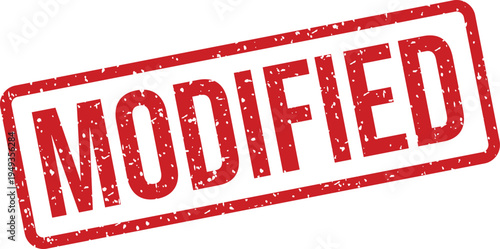 A bold red rubber stamp with the word MODIFIED clearly displayed on a pristine white background. This indicates a change or alteration
