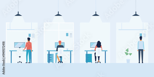 Modern office space with people working at desks viewed from the side