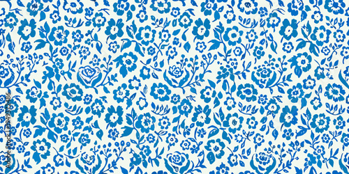 Dense blue floral pattern covering a white background surface