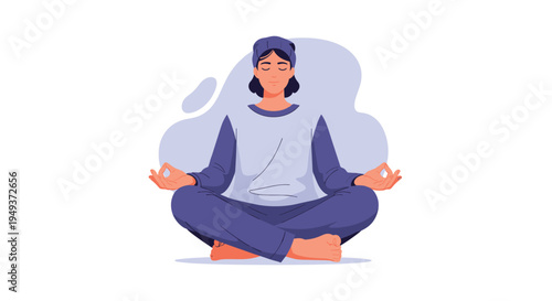 Person in blue comfortable clothing sits in a lotus yoga pose for meditation with eyes closed in a peaceful state on white.