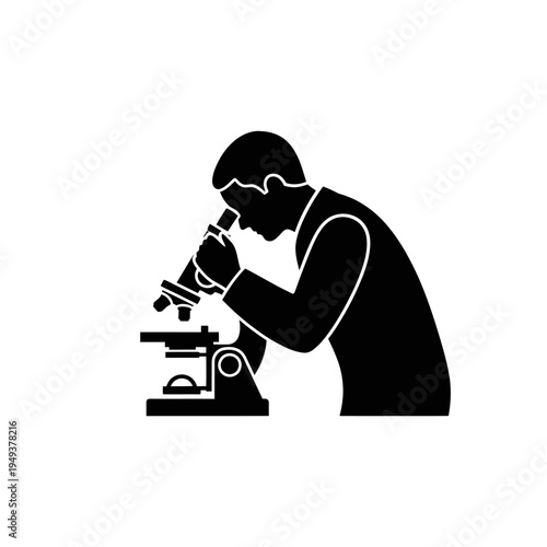 Scientist examines samples under a microscope in a laboratory setting.
