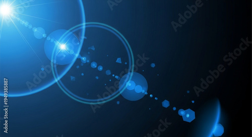 Bright blue lens flare effect on a dark background.