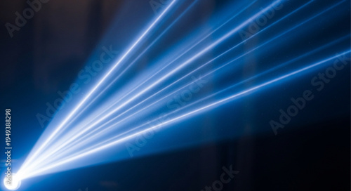 Bright Blue Laser Beams Shining in Darkness.