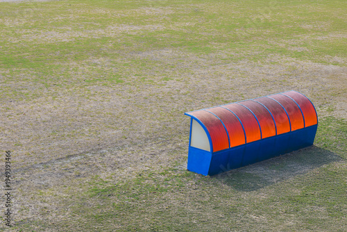 Covered team bench on sports field