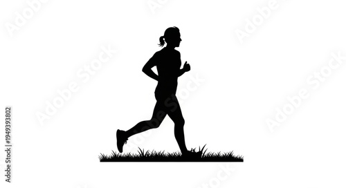 Silhouette of a woman running outdoors on grass.