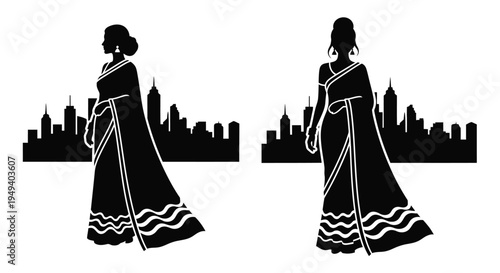 Two women in saris against a city skyline striking silhouette