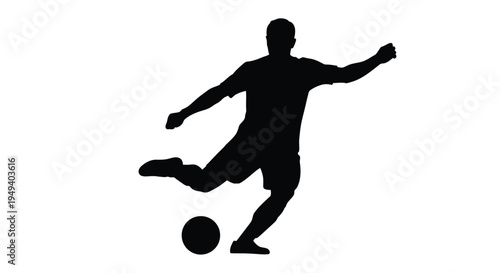 A soccer player kicking a ball in dynamic motion silhouette