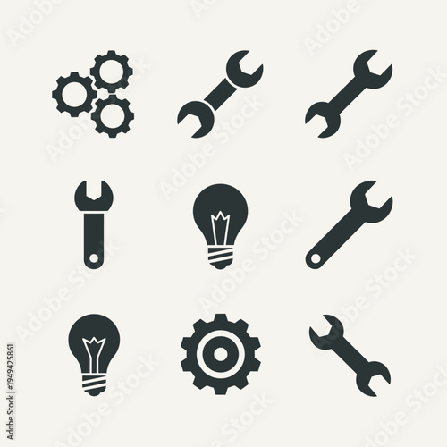 Black icons of tools and gears.