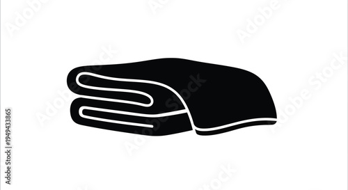 A simple black silhouette of neatly folded towels on a white background