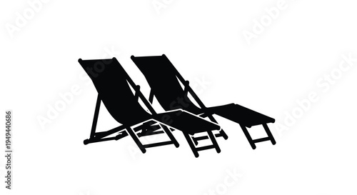 Two black beach chairs are positioned side by side on a white background