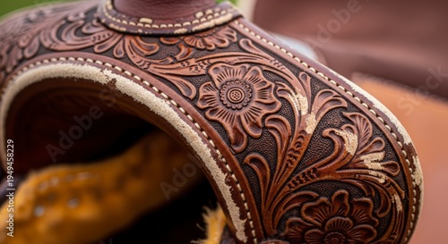Intricately designed leather horse saddle closeup.