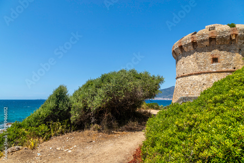 Idyllic sandy beach with turquoise water and rocky coastline near Ajaccio, Corsica, Mediterranean summer landscape