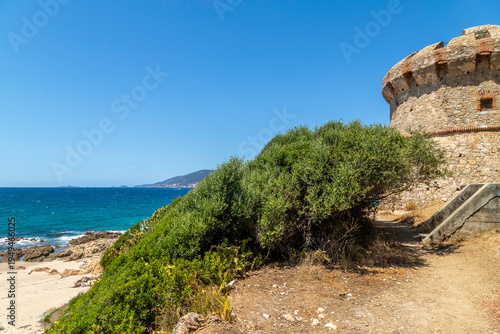 Idyllic sandy beach with turquoise water and rocky coastline near Ajaccio, Corsica, Mediterranean summer landscape