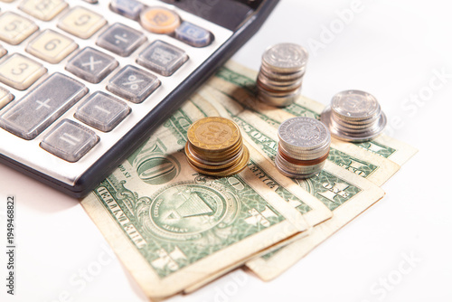 calculator and money on white background, business and finance concept