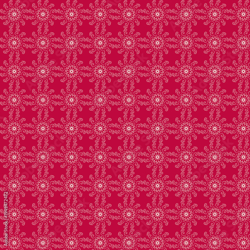 Seamless decorative floral swirl pattern with white ornamental curls on red background. Elegant vintage repeating design perfect for wallpaper, textiles, wrapping paper and festive backgrounds.