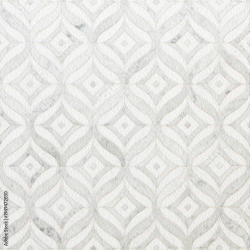 Elegant embossed white geometric pattern with soft marble texture. Luxury seamless background perfect for wallpapers, interior design, packaging and sophisticated graphic design.
