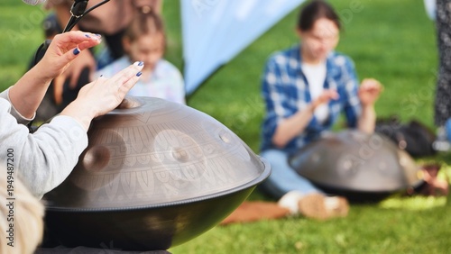 Billede på lærred People playing hang drums and handpans at India Day festival in Moscow park