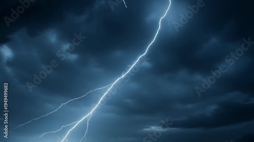 Dramatic lightning storm illuminating a night sky filled with dark, ominous clouds