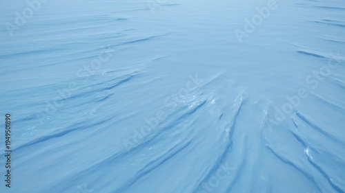 Frozen landscape with sweeping icy formations in a monochromatic blue palette