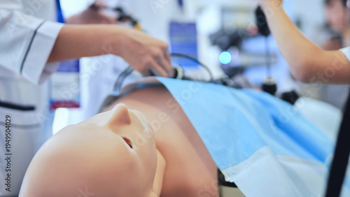 Canvas Print Medical students practicing laparoscopic surgery on a manikin during training si