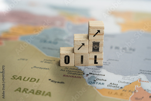 Wooden letter blocks spelling OIL arranged as a rising bar graph with arrow and barrel icons on a map of the Middle East, symbolizing increasing oil prices and energy market growth