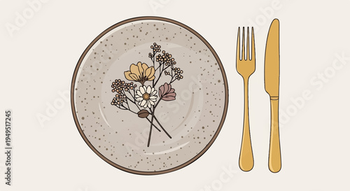 Elegant dining setup with floral plate and golden cutlery.