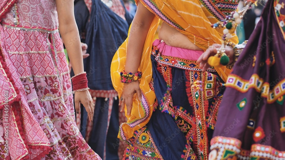 Naklejka premium Women dancing in traditional clothes celebrating Ganesh Chaturthi festival in India