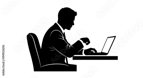 Silhouette of a businessman working on a laptop at a desk, focused on his task.