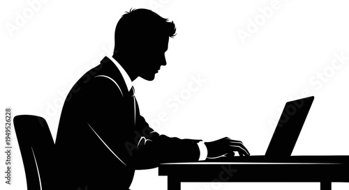 Silhouette of a businessman working on a laptop at a desk, focused and productive