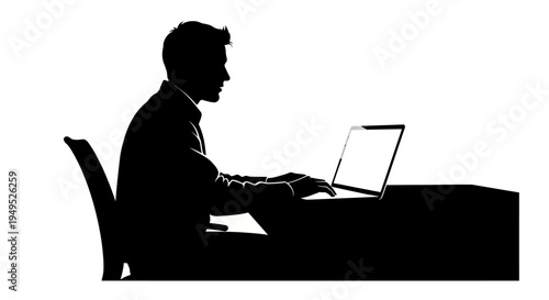 Silhouette of a businessman working on a laptop at a desk, side view