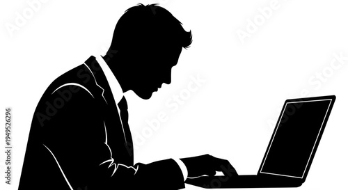 Silhouette of a businessman working on a laptop, focused on screen, business concept