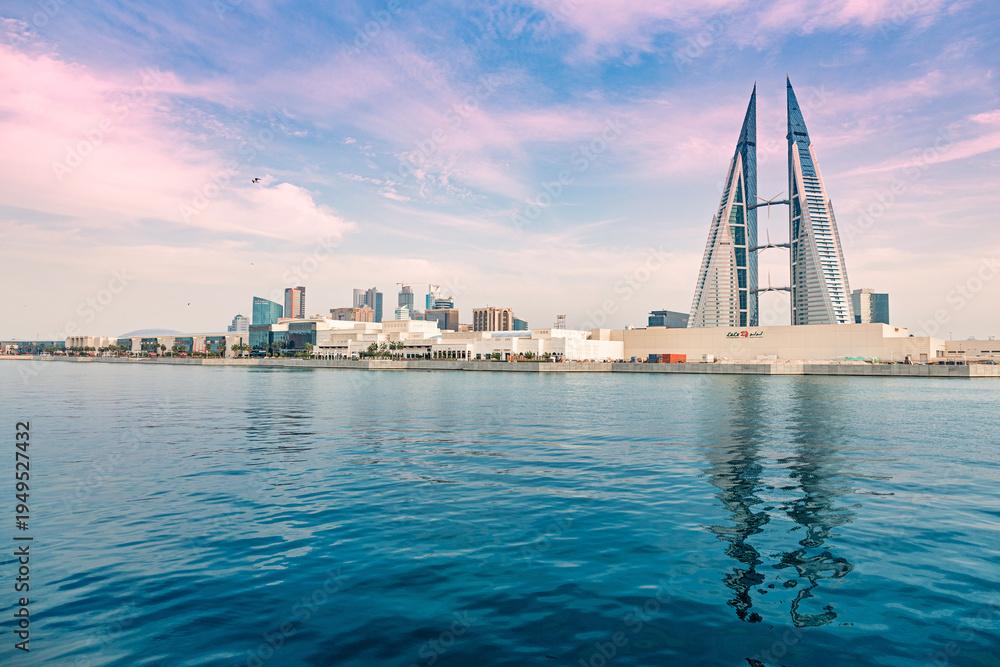 Fototapeta premium 2 December 2025, Bahrain, Manama: World Trade Center towers overlooking city across water bay near The Avenues Mall
