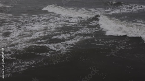 Ocean waves breaking and moving from drone above. Aerial ocean waves texture.