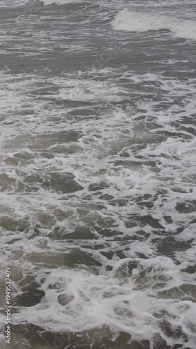 Powerful sea wave breaking closeup. Strong storm surf motion.