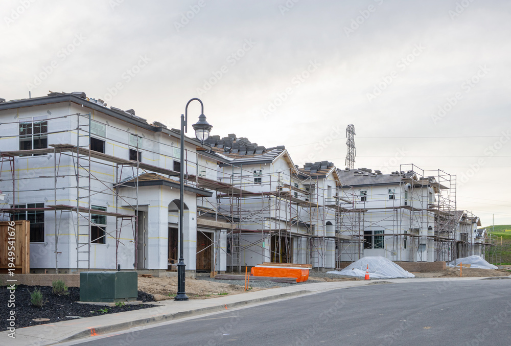 Fototapeta premium New Construction Homes Under Development in Suburban Residential Neighborhood, Housing Market Growth, Real Estate Development, and Modern Single Family Community Expansion