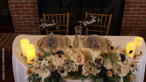 Romantic wedding sweetheart table with flowers and candles