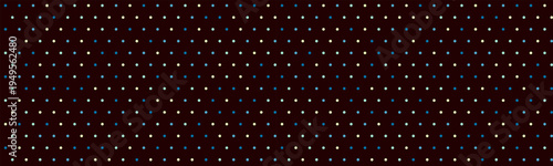 Abstract dark background with subtly varied tiny dots forming a repeating pattern.  Ideal for website banners, textures, or presentations needing a sophisticated, modern feel.