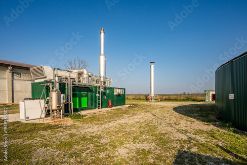 Fotografie Agricultural biogas plant with cogeneration unit and anaerobic digester dome