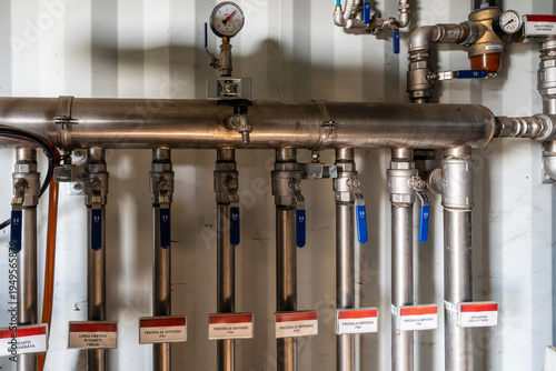 Industrial stainless steel hydraulic manifold system with ball valves.