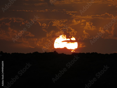 Golden Sun Sinking Behind the Horizon