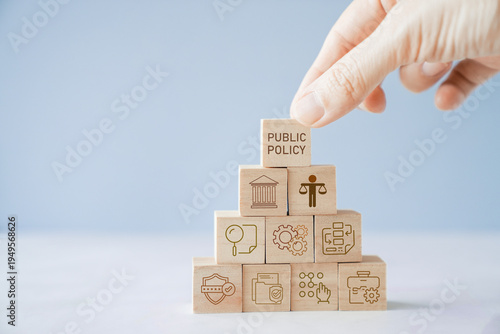 Cuadro en lienzo Public Policy, Governance, Law, Regulation, Government, Legislation, Strategy concept with businessman stacking wooden blocks to represent building a social framework for society