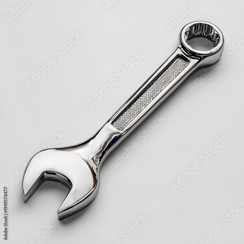 Adjustable wrench and nut on black background with chrome metal tools for repair and construction