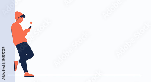 Young man in beanie and orange sweater texting on phone, leaning on wall