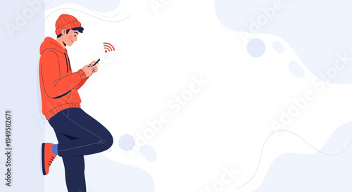 Young man in orange hoodie using smartphone with Wi-Fi signal, leaning against wall