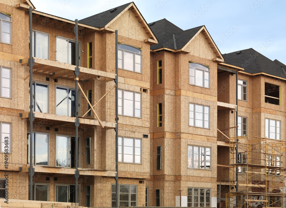 Obraz premium Construction Site Wooden frame residential condo houses being built
