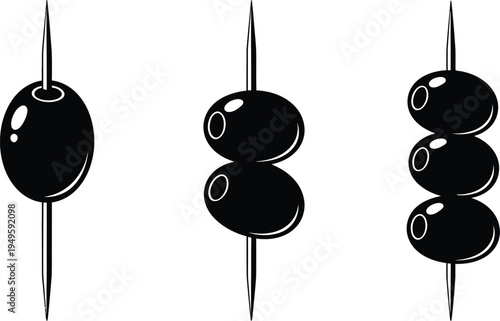 Simple black olives on toothpicks, a classic appetizer or garnish.