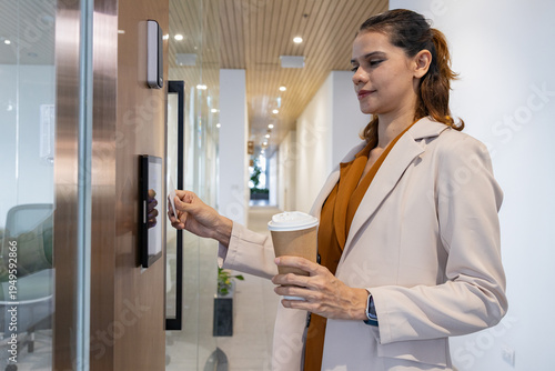 Office worker scanning access card with coffee